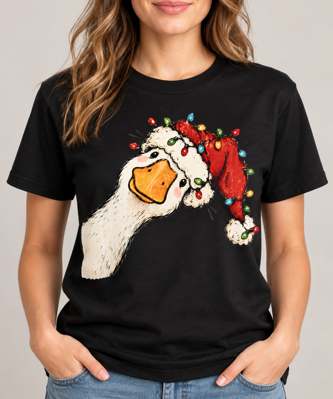 Christmas goose graphic tee on black shirt, shown on model