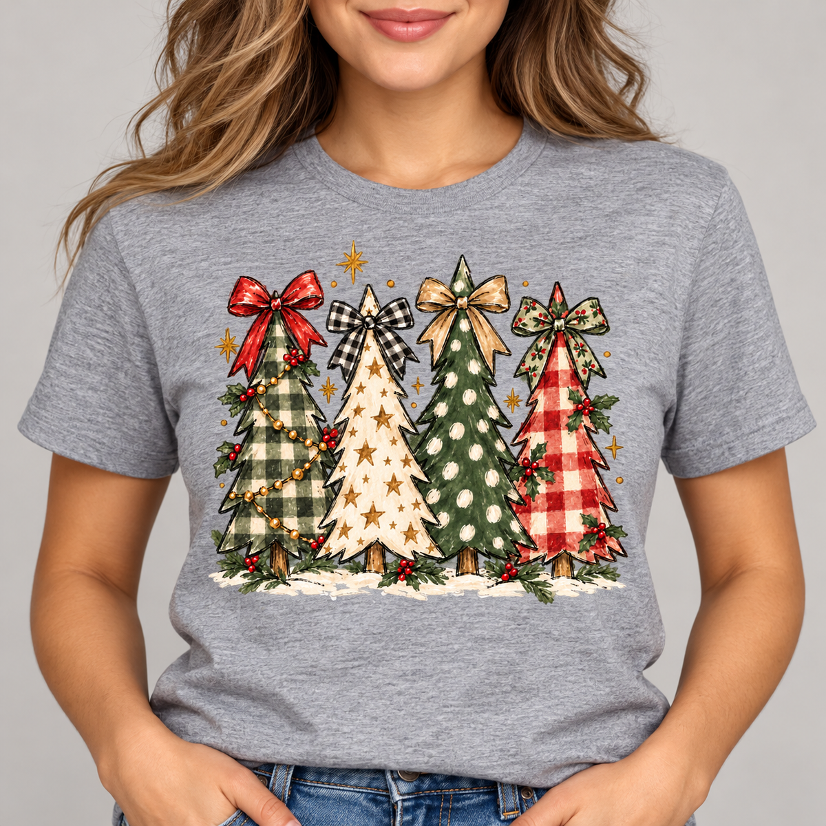 Christmas trees and bows graphic on a gray tee