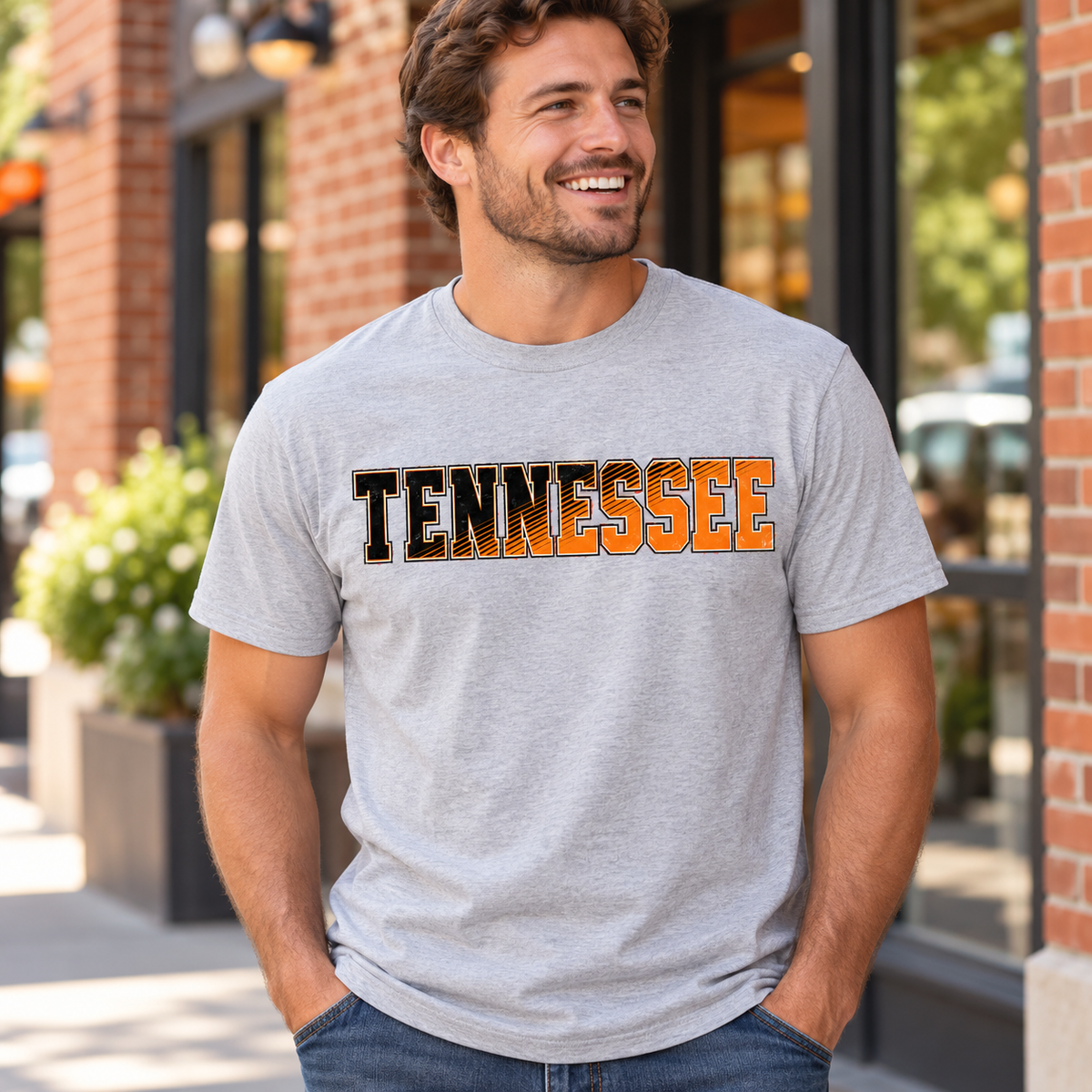 Man wearing ash gray Tennessee orange and black diagonal graphic tee