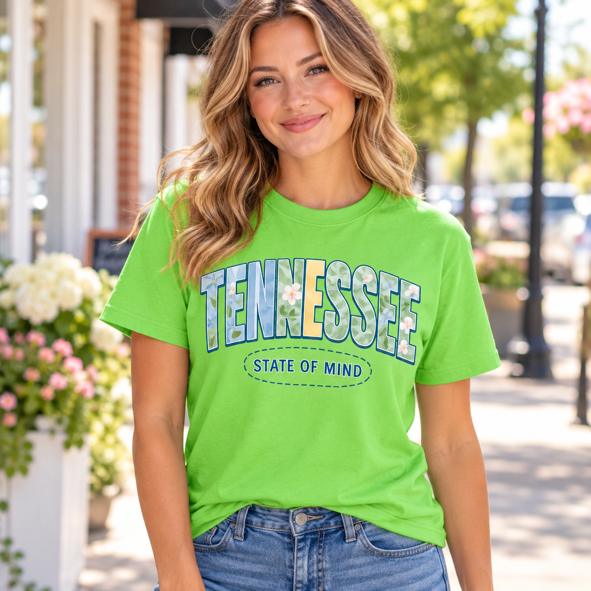 Woman wearing lime green Tennessee State of Mind floral graphic tee